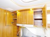 The ‘gourmet area’ or ‘kitchen’ as it’s also known, features a good range of eye-level shelved cupboards for stashing groceries and crockery in the Dethleffs Esprit T7150 DBM motorhome