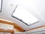 A large rooflight illuminates the interior by day and an array of different lighting does the job at night