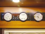 Classy barometer-style analogue controls and clock, in lieu of the usual LEDs, cluster above the entrance door of the Dethleffs Esprit