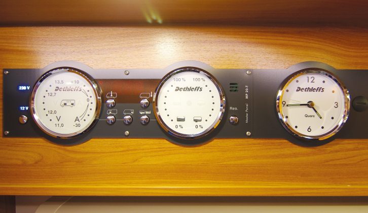 Classy barometer-style analogue controls and clock, in lieu of the usual LEDs, cluster above the entrance door of the Dethleffs Esprit