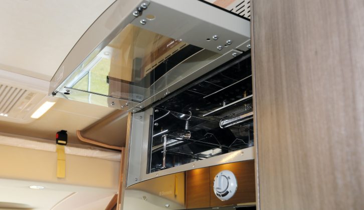 The gas-fuelled oven and grill are set up quite high above the fridge, so you’ll need to take care when retrieving hot dishes