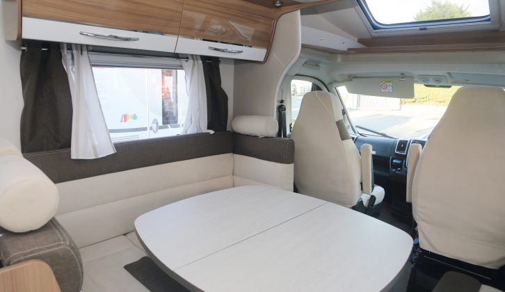 The table is hinged, to allow easier access through the motorhome's lounge