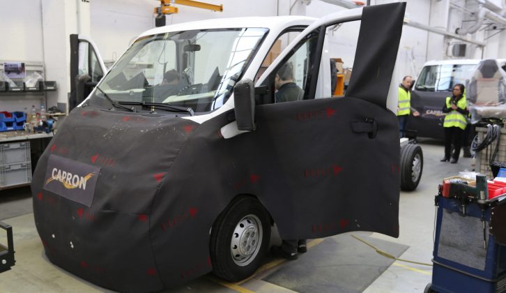 Protective aprons are fitted to the front of the vehicles as they make their way down the 450m-long assembly line