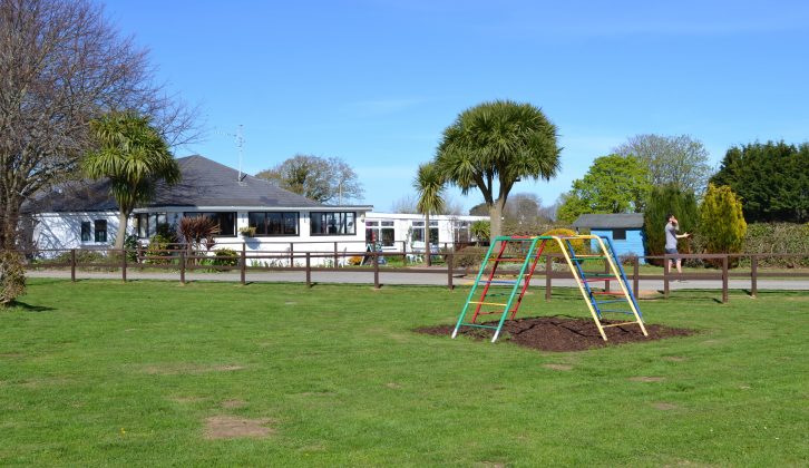 Safety surfaces are beneath the equipment in the children's play area at Beuvelande Campsite on Jersey – and the restaurant is shown just beyond it