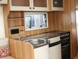 The kitchen in the Approach Autograph 730 has all the kit you need in a motorhome, including a dual-fuel hob, separate oven and grill, fridge, stainless steel sink and good worktop space