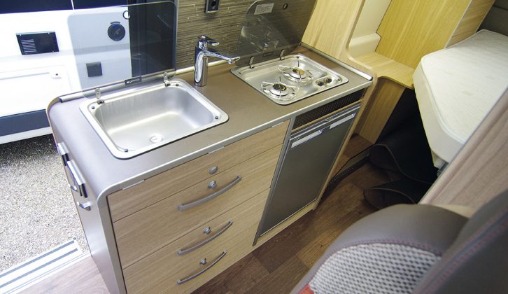 There may only be two gas rings, but there’s room enough on the stainless-steel hob for a couple of decent-sized saucepans in this high-top van conversion from Hymer