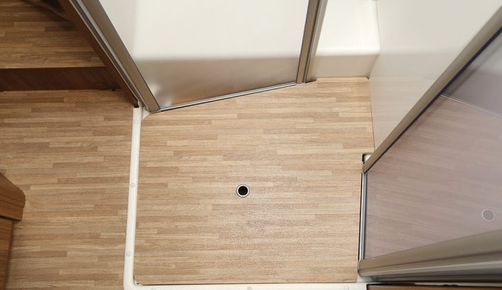 Keeping the shower doors open permits easy access to the bedroom in the Carado T 339. A trip hazard is removed by this wooden board for the shower tray