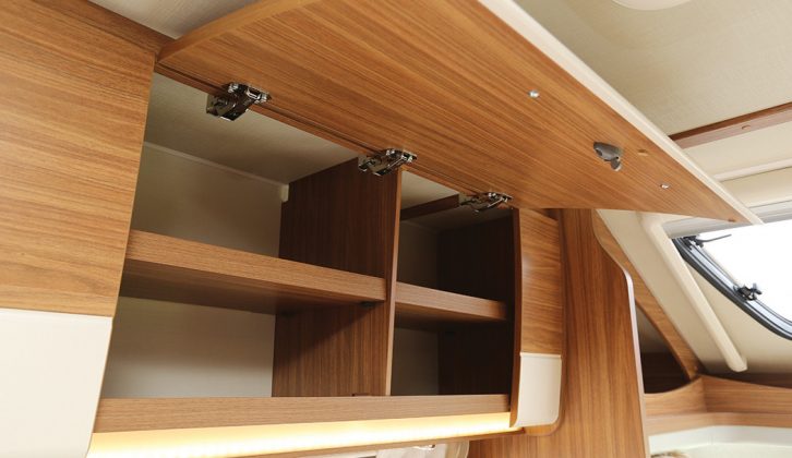 Spacious overhead lockers in the front lounge will accept plenty of items on those nicely divided shelves. The mood lighting at the bottom is a pleasing touch to find in a modestly priced motorhome