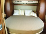 The rear island bed offers handy three-sided access, with wardrobes on either side plus a pair of overhead lockers for storage in the Carado T 339 motorhome