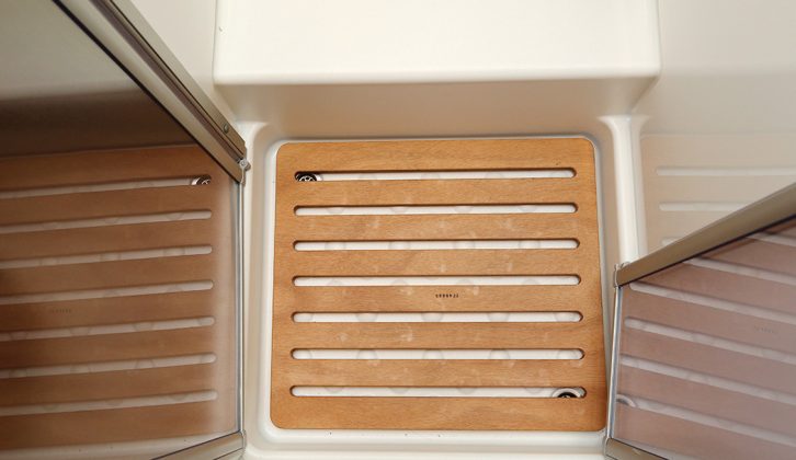 Shower tray has double drain holes for convenience and a wooden infill is provided as part of the enhanced UK specification