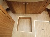 Storage for valuables is also included, here at the foot of the rear bed. The under-bed cupboard also houses the Truma Combi heater unit to keep you warm in the Carado T 339 motorhome