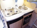 On-board motorhome chefs will need to get their food preparation done before lifting the lids of the hob and sink, unless you use the lounge table in the Sunlight T60