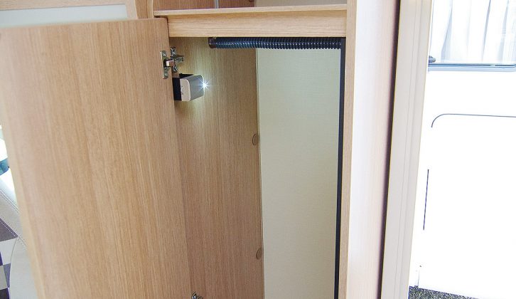 The hanging wardrobe is well detailed, with a built-in light and a corrugated rail cover to prevent hangers from sliding around when you're driving the T60 motorhome