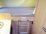 The bed is accessed by a fairly flimsy ladder; unfortunately it obstructs the washroom door if left in place, so you’ll need to stow it during the day. The T60's bed features individual reading lights, lockers and a privacy curtain