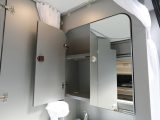 There's even a mirrored wall cupboard with plenty of space for washbags in the Adria Twin 500 S campervan washroom