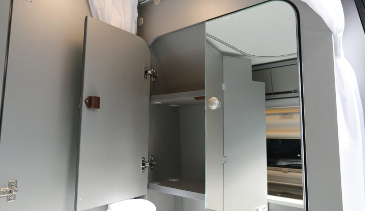 There's even a mirrored wall cupboard with plenty of space for washbags in the Adria Twin 500 S campervan washroom