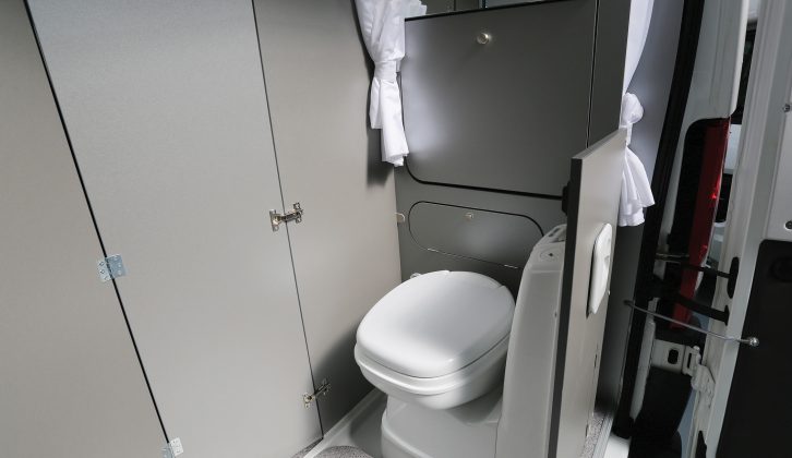 When not in use, the flip-up sink vanishes into the wall in the compact Adria Twin 500 S van conversion