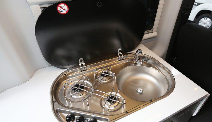 The hob has three gas burners and is integrated with the sink, with one lid covering the lot, which makes a handy work surface in the kitchen