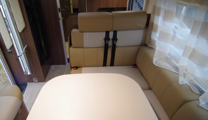 The half-dinette seating is typically rather upright and doubles as travel seats – the whole area converts into a second double bed