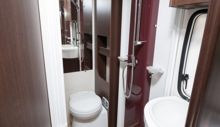 The corner washroom uses folding doors to create a central showering area, with duckboards underfoot to keep your feet dry in the Benimar Mileo 231