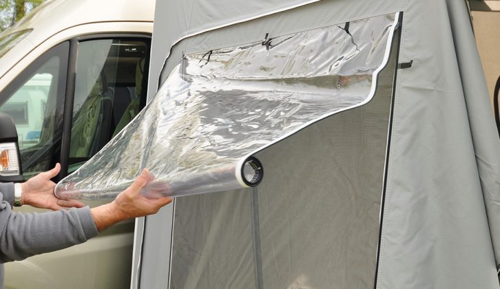 Roll-up windows with mesh screens are in the side panels