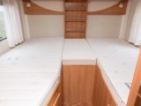 Popular fixed twin single beds feature in this Hymer ML-T 580, each with a side window