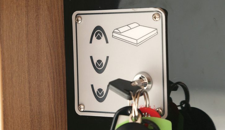 The drop-down bed at the rear of the Swift Rio 340 is electrically operated by this simple push-button control and turn-key isolator