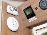The smoke alarm, carbon monoxide detector and heating/boiler controls are all grouped neatly together near the door in the Swift Rio 340