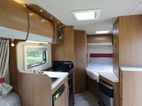 There’s a pleasing wide-open aspect and real feeling of space in the midships of the 715 – interior décor is classy for an affordable motorhome range