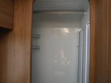 The well-sealed shower cubicle has a hanging rail for damp towels and clothes; a blown-air heat vent will help things dry