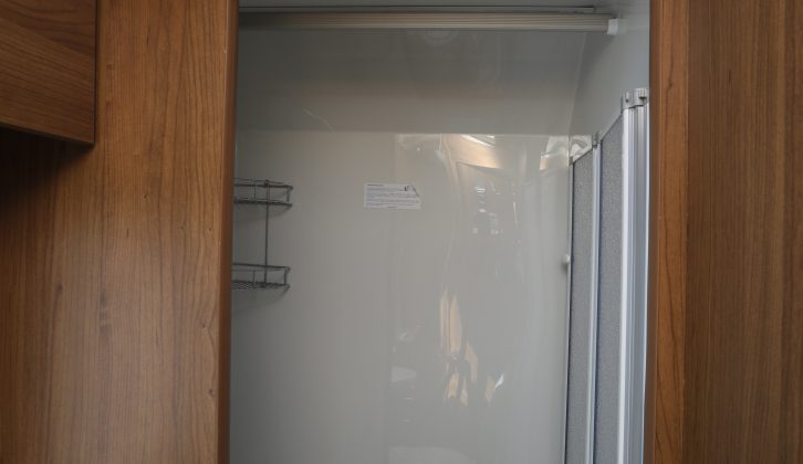 The well-sealed shower cubicle has a hanging rail for damp towels and clothes; a blown-air heat vent will help things dry