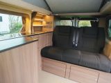 The floorplan has the familiar offside-kitchen camper arrangement, and there are two belted travel seats