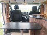 The dining table can serve three and stands firmly on a single pedestal – read more in the Practical Motorhome Hillside Leisure Ellastone review