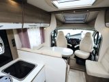 Inside the Bavaria T700C Style, which has an island bed, half-dinette lounge floorplan on a 7m body, with a slimline fridge.