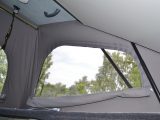 The pop-up roof has a flyscreen on either side with zipped covers to keep out cool night air and bright morning light