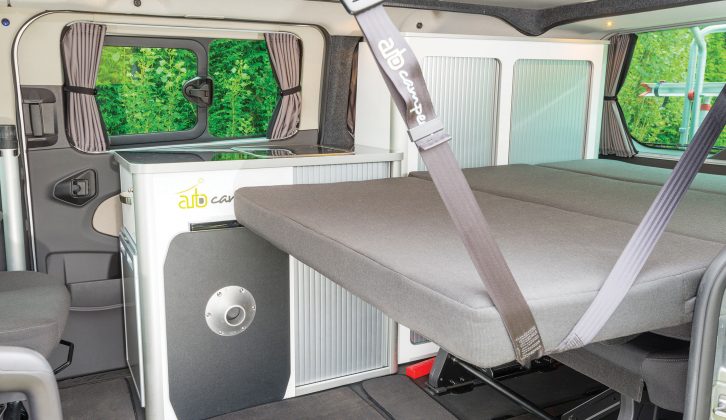 Our test ’van had the standard bed plus an optional bed extension, supported by a strap and kitchen unit handle
