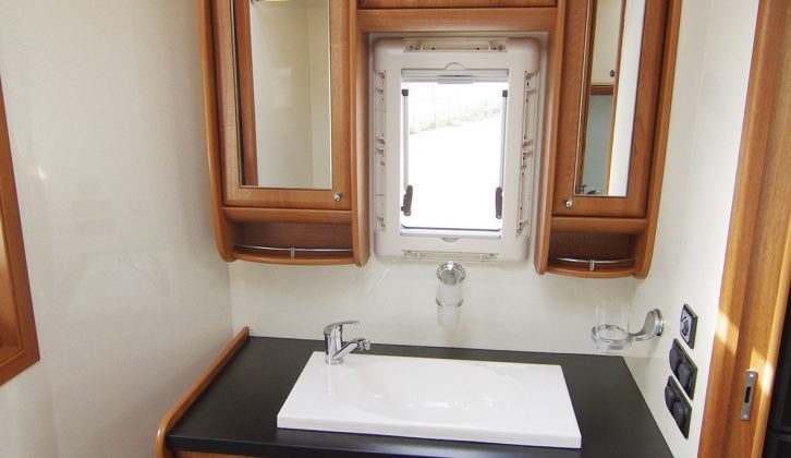 Opposite the toilet is this beautiful vanity unit with storage beneath