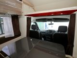 A spacious double bed is located above the driver’s cab in the Rimor Koala Elite 722 - one of three double beds in the motorhome