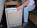 Installing a compressor fridge is straightforward; a three-way fridge is more involved