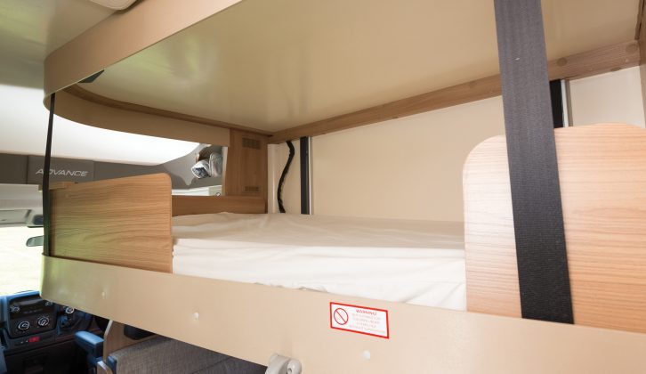 The drop-down bed is suspended from the ceiling by four webbing straps, giving a 200kg weight limit