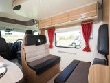 A large window in the dinette helps the spacious feel, and there are spotlights beneath the drop-down bed