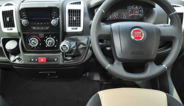 Standard spec includes a padded steering wheel and leather gear level cover; cab air con costs £1000 extra