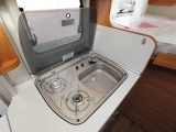 The two-burner gas hob is part of a single unit with the small sink