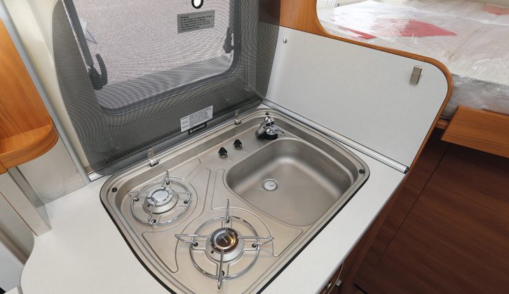 The two-burner gas hob is part of a single unit with the small sink
