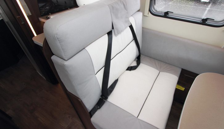 TRAVEL FOR TWO 
This comfortable double travel seat is beside a window but a higher head restraint would help