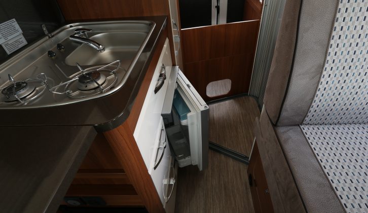 The compact kitchen has a sink and two gas burners, a grill and a 50-litre fridge