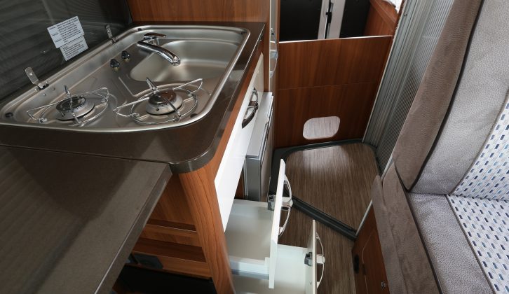 The kitchen sink/hob has a cover you can use as a worktop and beneath are soft-close drawers