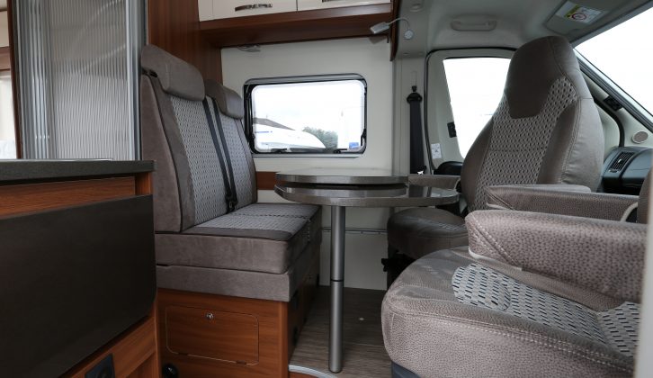 The cab seats swivel and turn the front dinette into a lounge for four