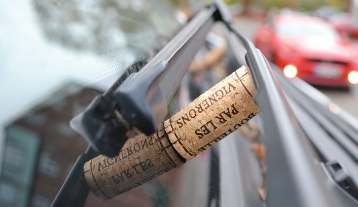Place a wine cork against the wiper arm to stop it sticking to your motorhome
