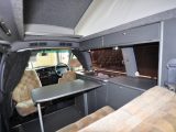 The table clips onto a rail for easy adjustment and the passenger's cab seat swivels in the Wellhouse Toyota Noah